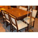Sliding leaf oak dining table with six matching chairs