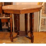 Octagonal wooden occasional table with undertier and turned legs.