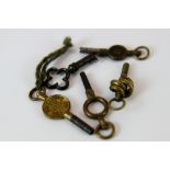 Five antique pocketwatch keys including a knot key