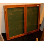 Wood framed display case with locking glass doors (key in office)