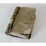 Unusual silver plated vesta and stamp case in the form of a book with impressed manx three legs of