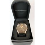 Emporio Armani chronograph wristwatch with multi-dial black face with a rose gold surround on a