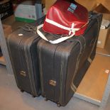 Two modern suitcases and a vintage Emley FC bag