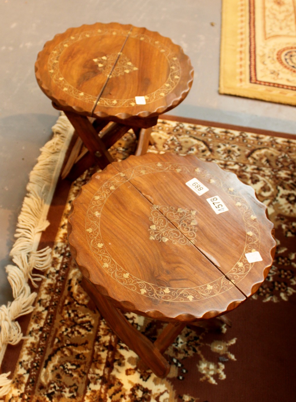 Pair of collapsible stained pine campaign tables inlaid with brass