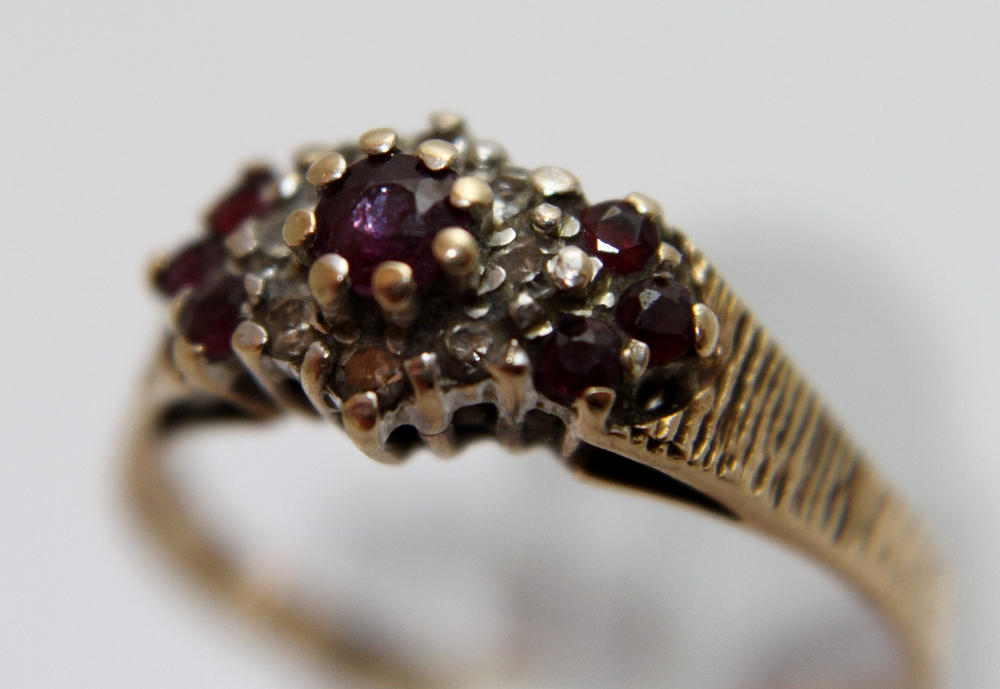 9 ct gold ruby and diamond cluster ring, size R. 2.