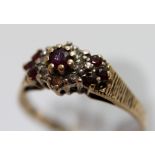 9 ct gold ruby and diamond cluster ring, size R. 2.