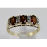 9 ct gold cinnamon zircon and diamonds ring,