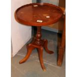 Walnut occasional table with central pillar and four fluted leg supports