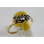 18 ct yellow gold antique three stone set diamond ring, size N.