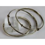 Three sterling silver bangles,