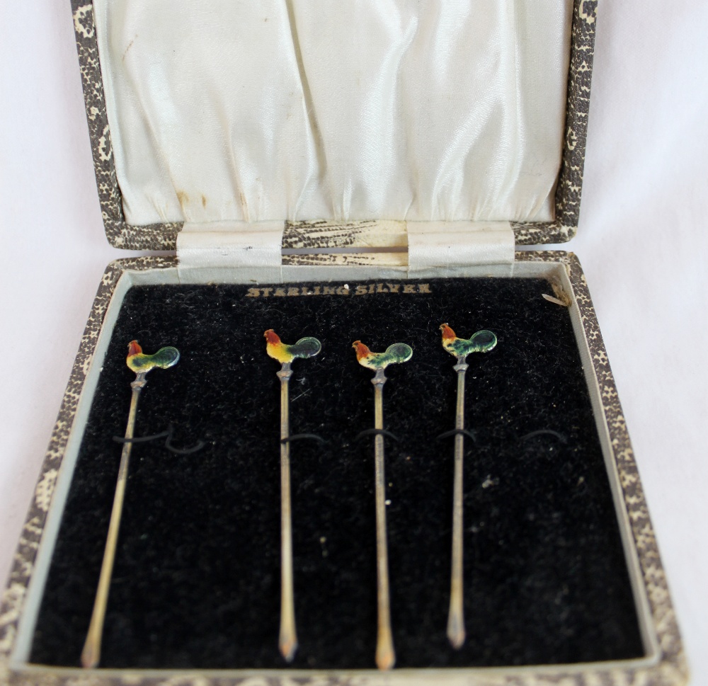 Set of four sterling silver cockerel headed cocktail sticks