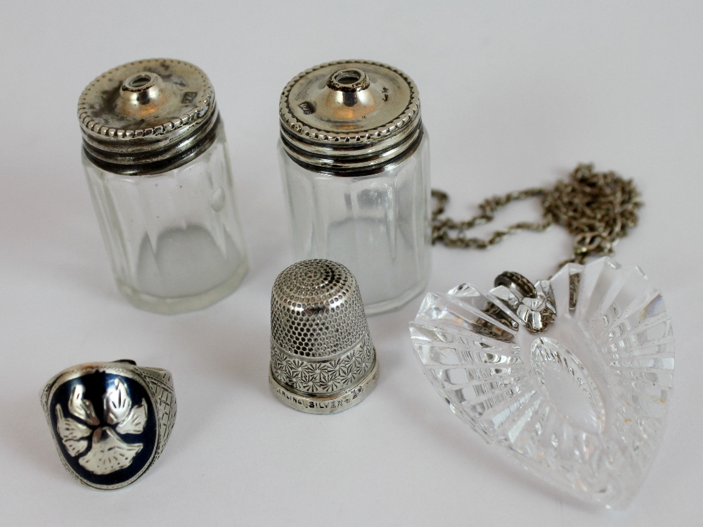 Selection of silver items including silver topped salt and pepper, thimble,