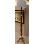 Heavy mahogany one piece turned standard lamp on a 3 footed base