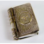 Silver plated vesta case with stamp case in the form of a book with three legs of man impressed to