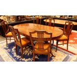 Large oval mahogany table with brass inlay with six matching shield back chairs,