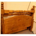 Large heavy pine double bed ends with turned bar stretchers.