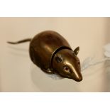 Unusual brass vesta case in the form of a mouse with red stone set eyes,