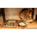 Brass framed mirror, brass ships wheel clock,