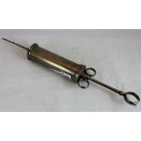 Antique white metal medical syringe