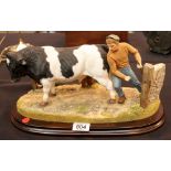 Country Artist standing four square Holstein bull figure,