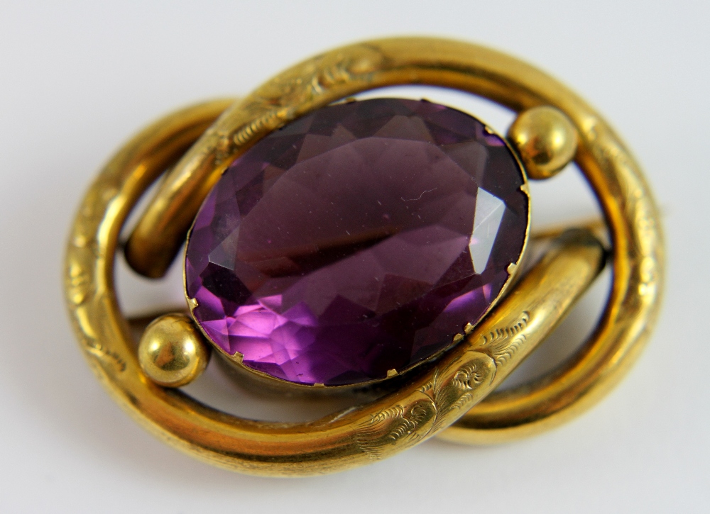 Victorian brooch set with a purple stone