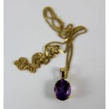 9 ct gold set amethyst stone on 9 ct gold chain. Total weight 3.