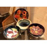 Four Moorcroft dishes including open pomegranate design
