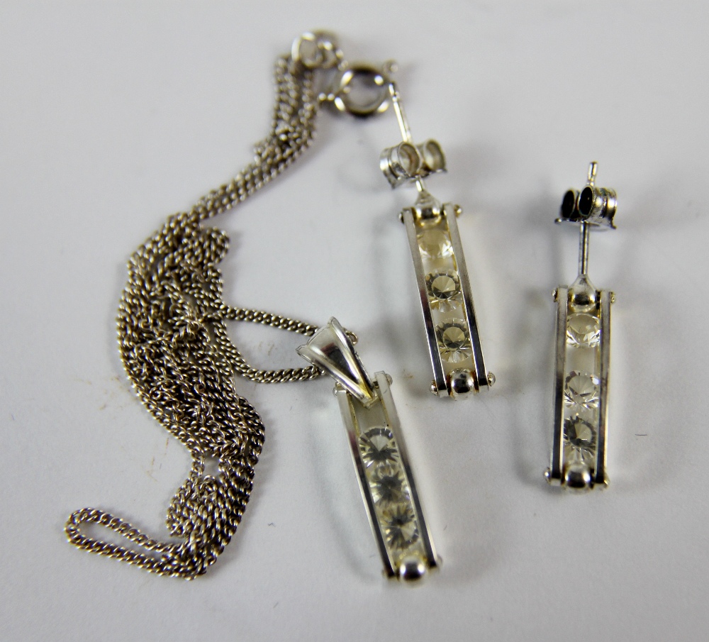 Matching diamante set earrings and pendant set on 925 silver