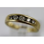 9 ct yellow gold five diamond set ring,