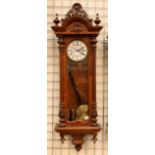 Victorian carved walnut wall clock with continental movement, enamel dial,