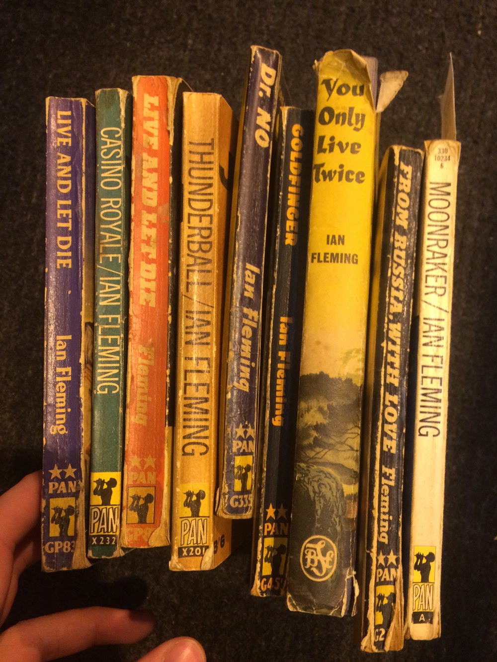 Eight James Bond Ian Fleming paperback books and a hard back Book Club edition of you only live