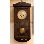 Carved wood wall hanging chiming clock by W. C.