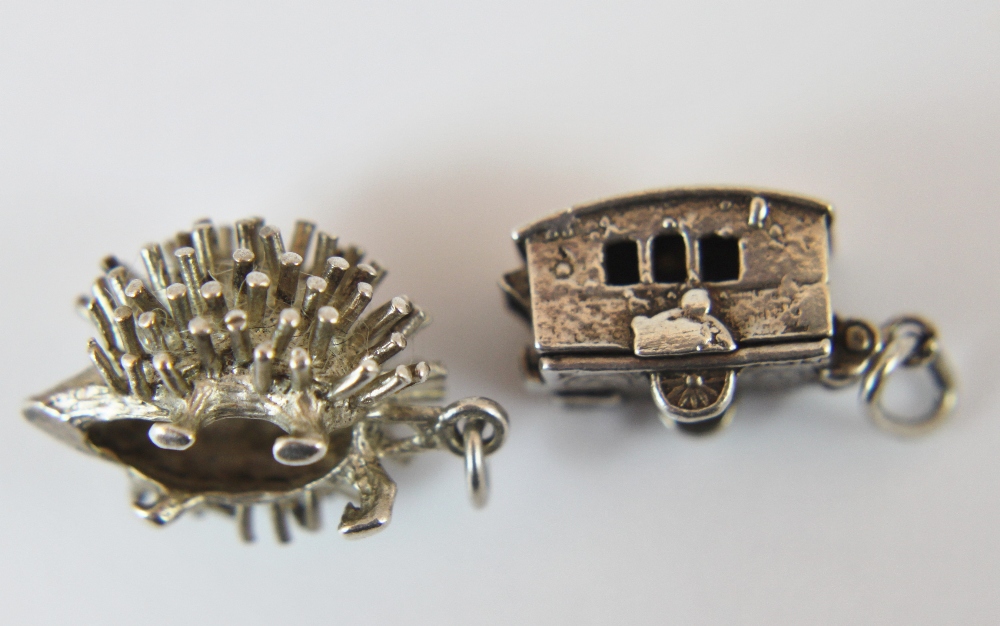 Two silver charms vintage caravan and hedgehog