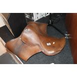 Large padded leather horse saddle