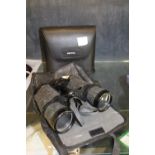 Pair of binoculars in a carry case and a pair of Pentax binoculars