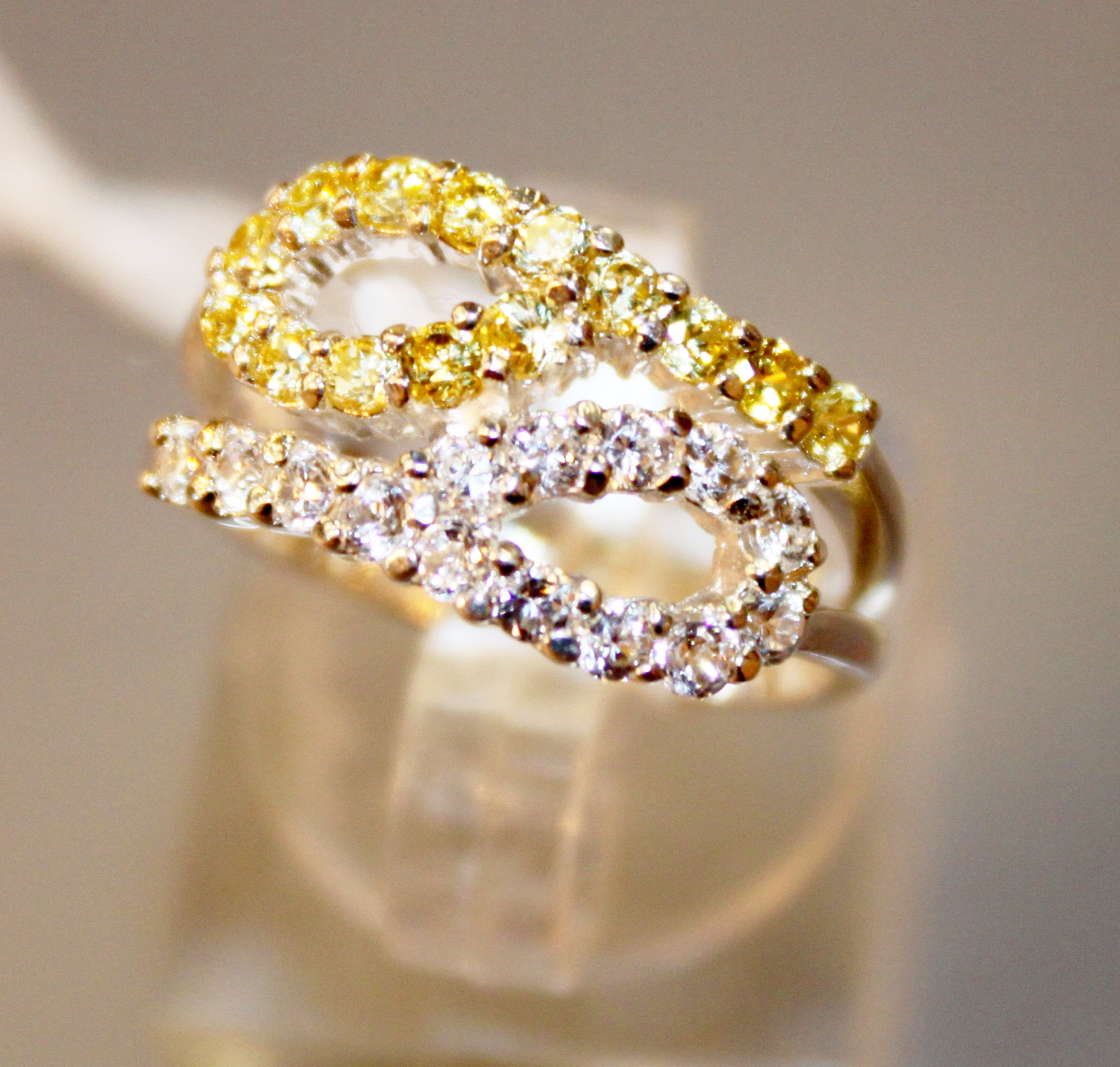 Sterling silver white and yellow stone double loop ring,