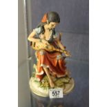Capodimonte figurine of a lady with guitar,