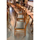 Five pine and leather seated ladderback dining chairs