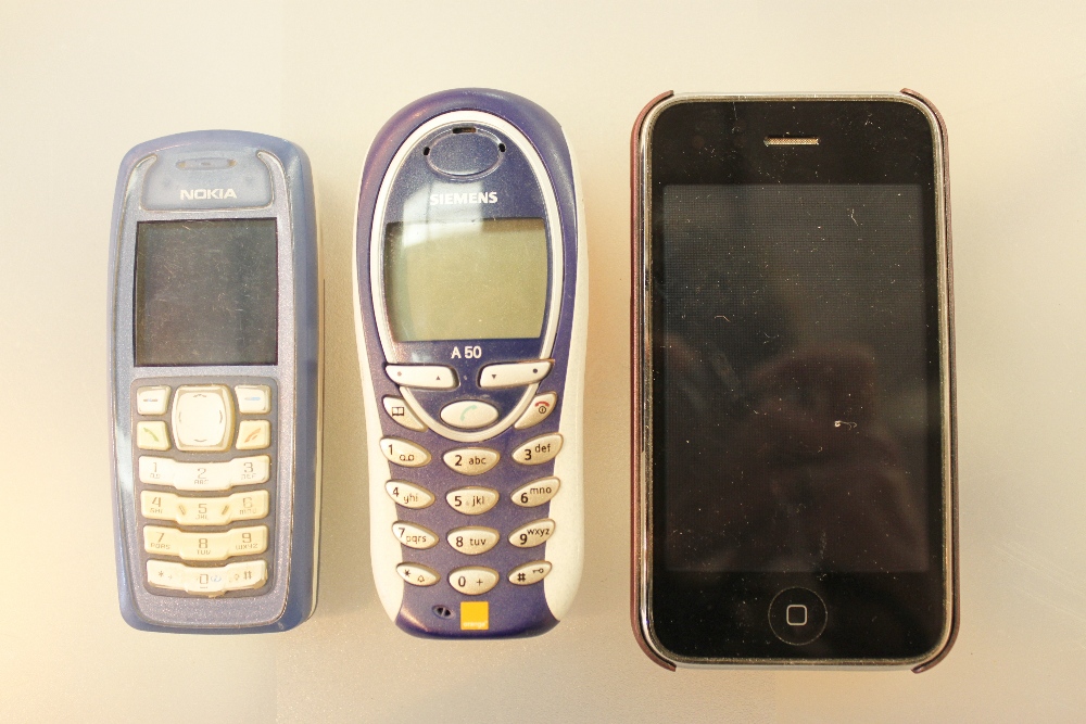iPhone with two extra mobile phones including Nokia and Siemens