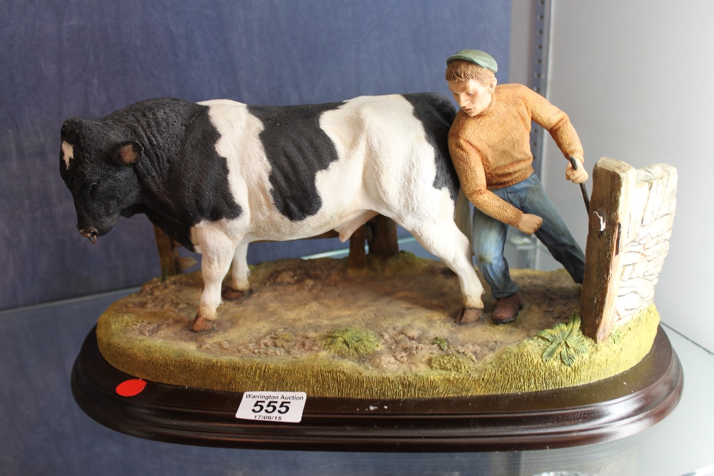 Country Artist standing four square Holstein bull figure,