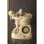 Bisque continental cherub vase with inset mechanical clock