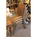 Four stacking metal deck chairs