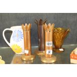 Three trench art spill holders, a jug and a vase.