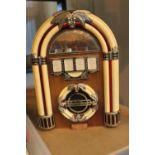 A radio in the form of a 1950's juke box.