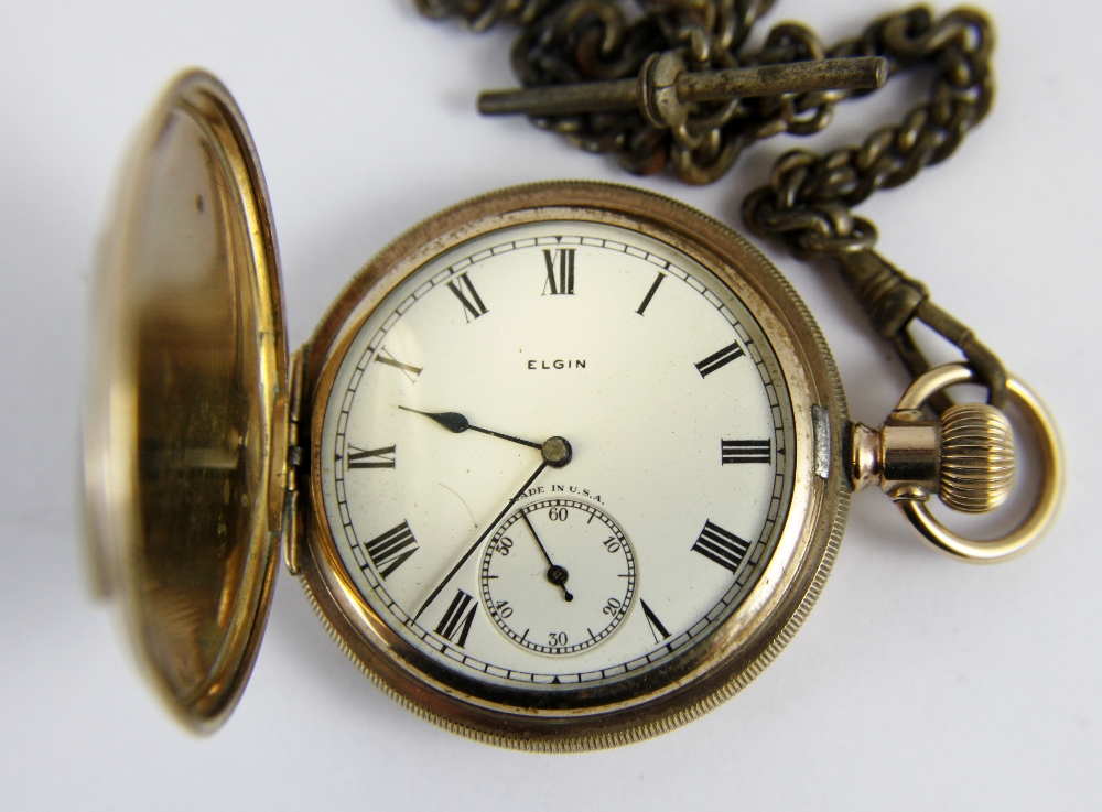 Gold plated full hunter pocket watch with roman numerals and Albert chain