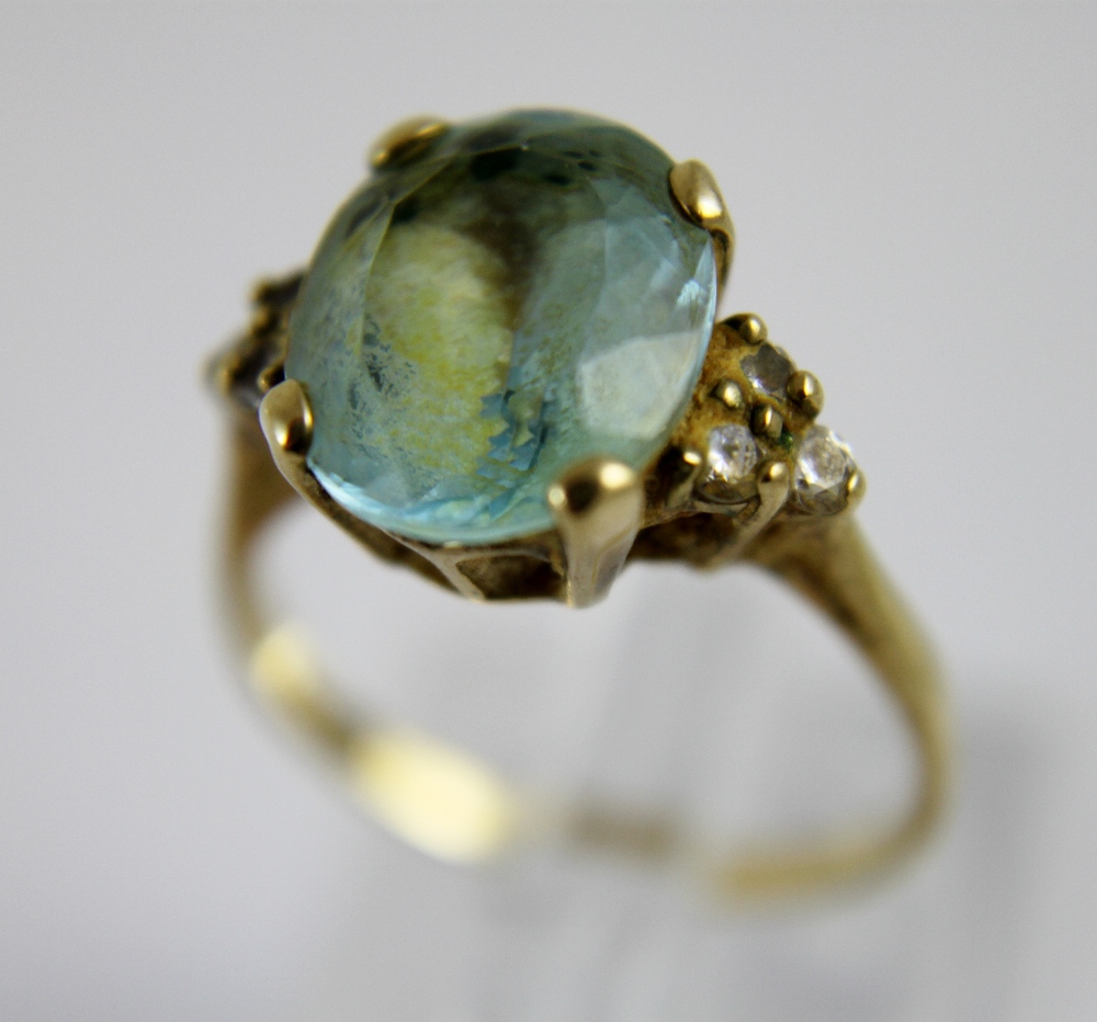 9 ct gold and blue stone ring.