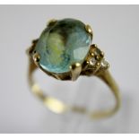 9 ct gold and blue stone ring.