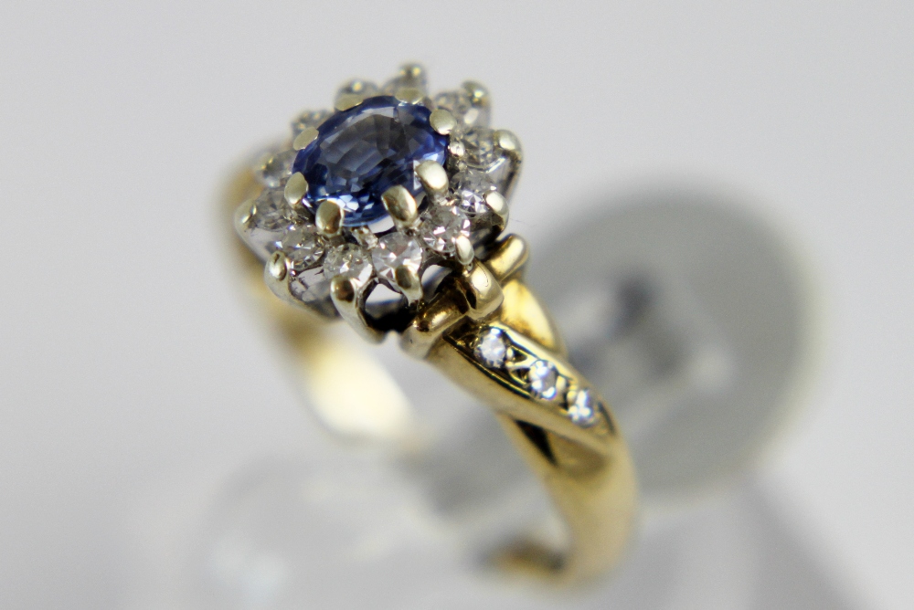 9 ct gold sapphire and diamond cluster ring. 2.