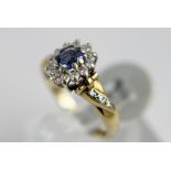 9 ct gold sapphire and diamond cluster ring. 2.