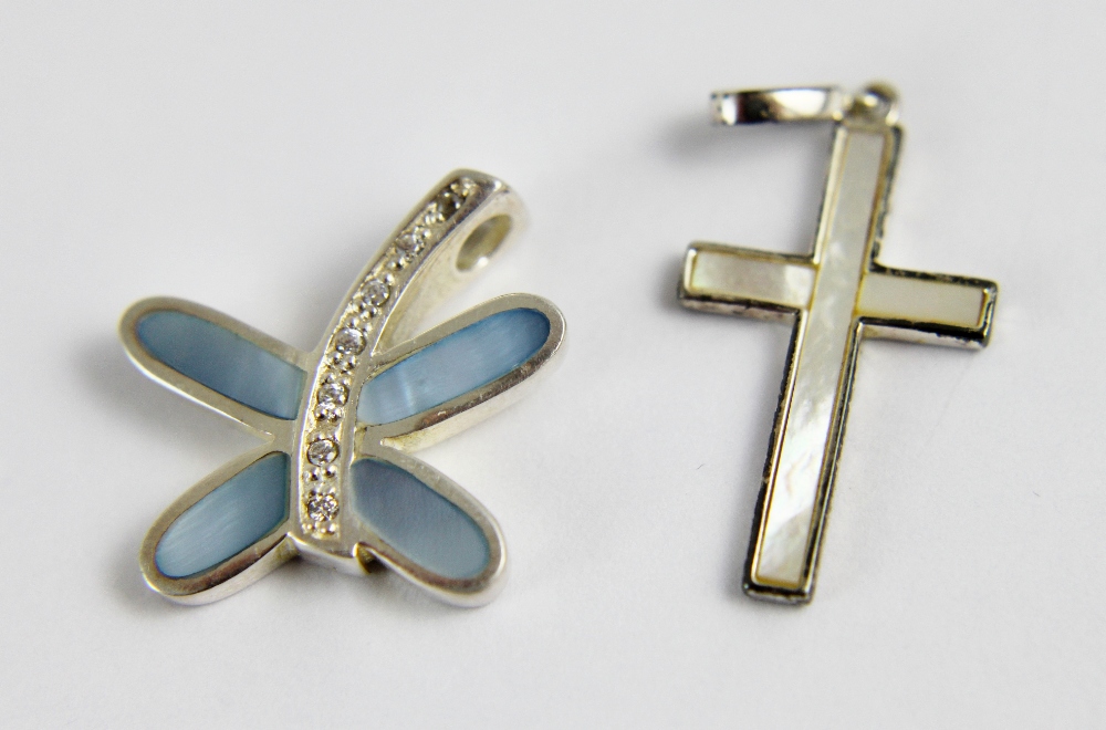 Two sterling silver pendants one with butterfly and the other cross both with mother of pearl inlay